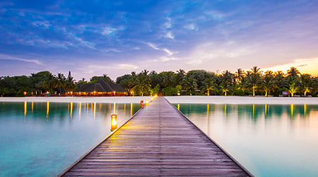 Resort bridge at night in the Maldives