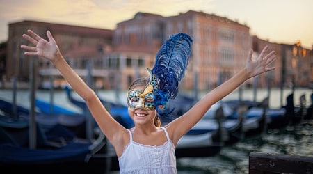 The Wonders of Italy Family-Friendly Tour - Venice, Italy Young girl wearing carnival mask in Venice, Italy