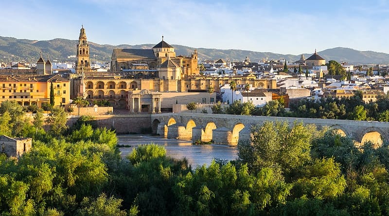 Morning view of the Cathedral, Mezquita and roman bridge in Córdoba, Spain