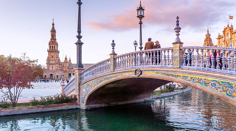 Couple at Plaza de Espana in Seville, Spain Couple at Plaza de Espana in Seville, Spain