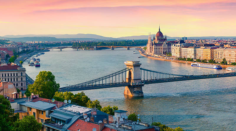 Sunset view of the parliament building and Danube River in Budapest, Hungary. Parliament building and Danube River in Budapest, Hungary at sunset