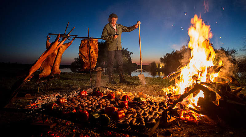 Chef Francis Mallmann tends the fires at Siete Fuegos restaurant in Mendoza, Argentina Chef Francis Mallmann tends the fires at Siete Fuegos restaurant in Mendoza, Argentina