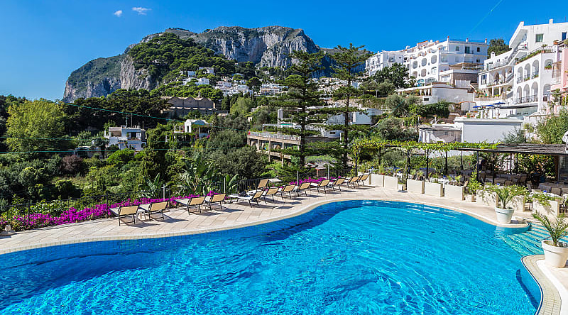 Resort pool on Carpri island with beautiful views of rocky cliffs, Italy Resort pool on Carpri island with beautiful views of rocky cliffs, Italy