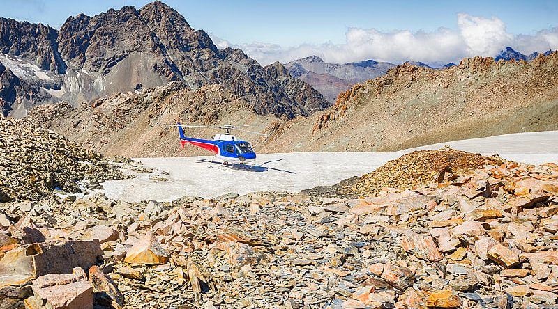 Helicopter on the southern alps mountain range in New Zealand Helicopter on the southern alps mountain range in New Zealand