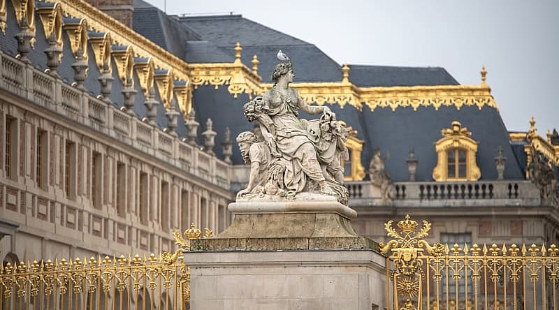 Statue and ornate architecture of Versailles in France. Statue and ornate architecture of Versailles in France.