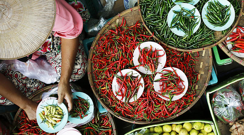 Culinary Journey of a Lifetime to Thailand, Vietnam, and Cambodia Peppers being sold at a market in Vietnam