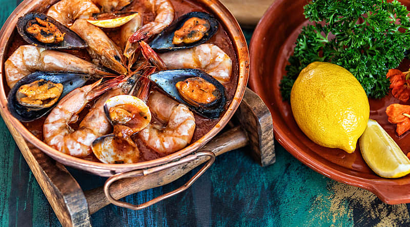Authentic Culinary Tour of Portugal - Seafood Cataplana Seafood Cataplana, traditional Portuguese stew served in the Algarve region of Portugal