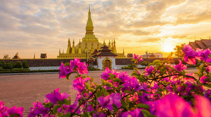 Pha That Luang in Vientiane, Laos Sunrise over Pha That Luang, Golden Pagoda, in Vientiane, Laos
