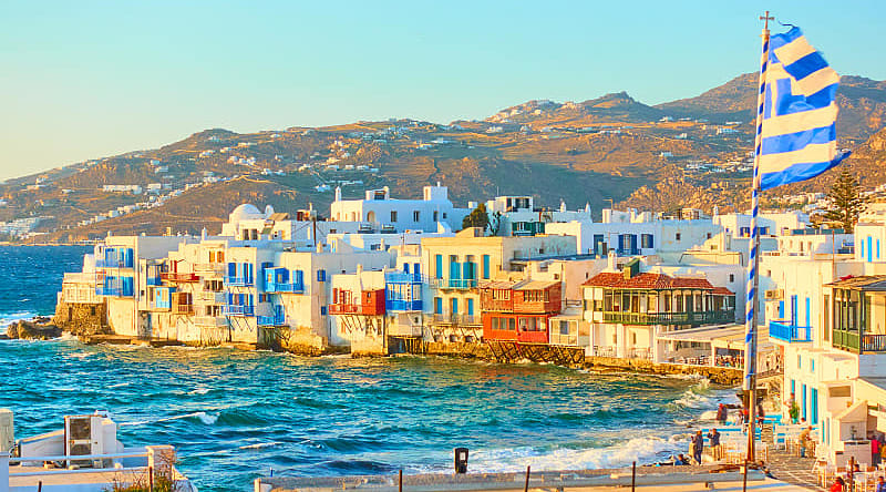 Little Venice, Mykonos, in the rays of the rising sun Little Venice, Mykonos, in the rays of the rising sun
