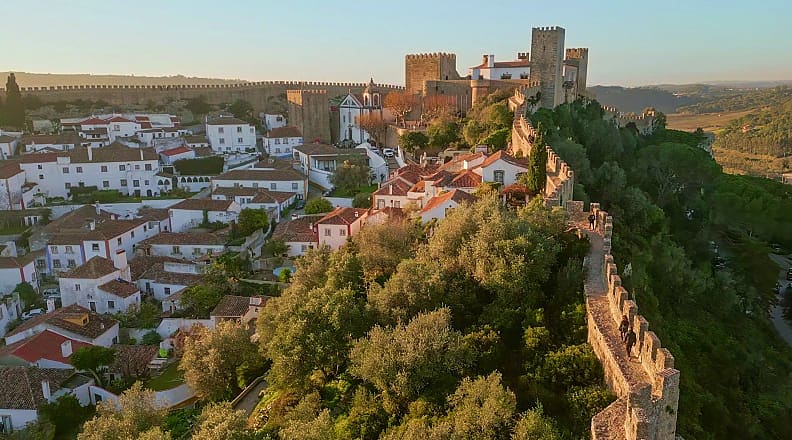 Óbidos, Portugal Panoramic view of the medieval town of Óbidos, Portugal, with historic walls and charming white houses