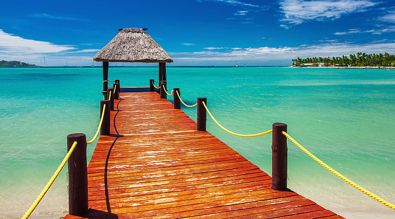 Wooden jetty on tropical beach in Fiji Wooden jetty on tropical beach in Fiji