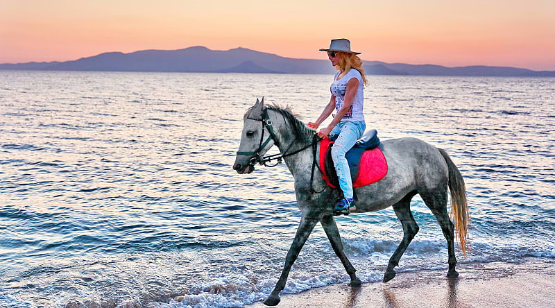 Horseback riding on the beach in Greece. Horseback riding on the beach in Greece.