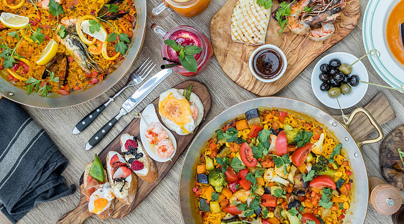 Savor the flavors of homemade food and big city cuisine on this trip to Spain Savor the flavors of homemade food and big city cuisine on this trip to Spain