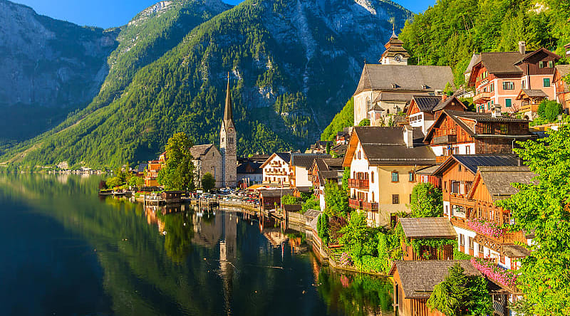 Village and Alpine lake Hallstatt in Austria Famous mountain village and Alpine lake Hallstatt, Austria