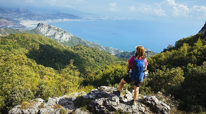 Hiker admiring the view along the Path of the Gods in the Amalfi Coast, Italy