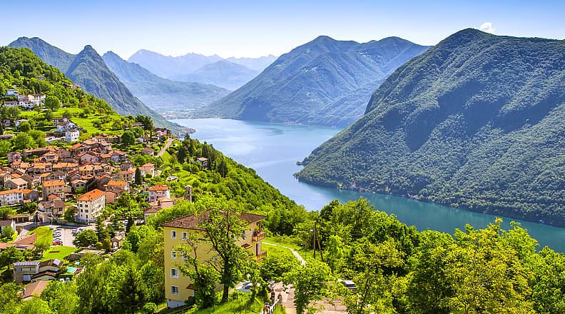 View to Lugano city, Lugano lake and Monte San Salvatore from Monte Bre, Ticino, Switzerland. View to Lugano city, Lugano lake and Monte San Salvatore from Monte Bre, Ticino, Switzerland.