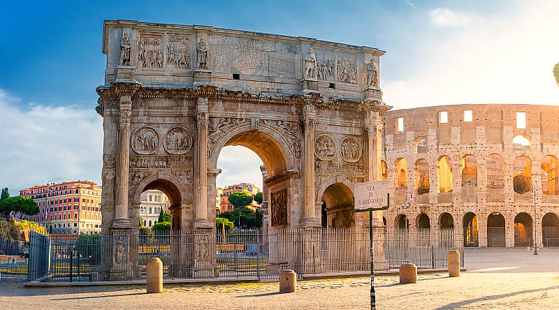 View of the Arc de Triomphe of Constantine and the Colosseum, Rome Discover the famous Colosseum, which takes you back in time to Ancient Rome.