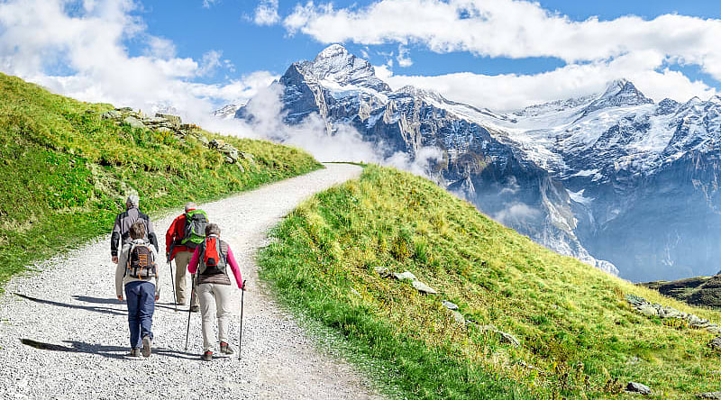 Family hiking in the Swiss Alps Family hiking in the Swiss Alps