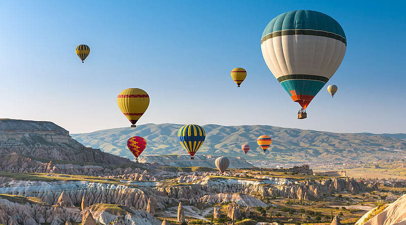 Hot air balloon floating above Cappadocia, Turkey.