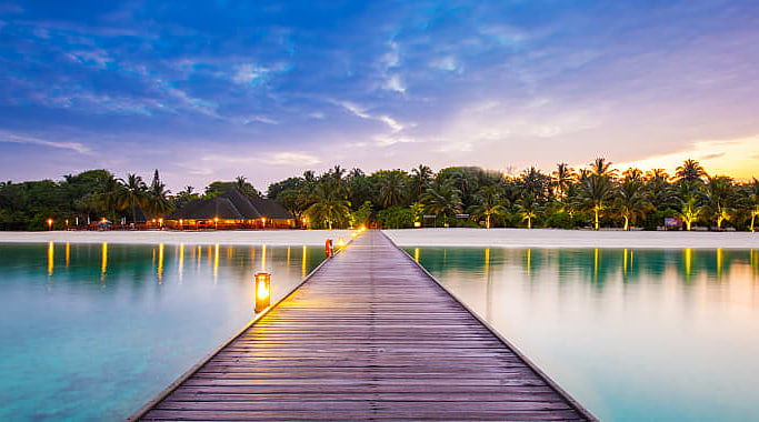 Resort bridge at night in the Maldives