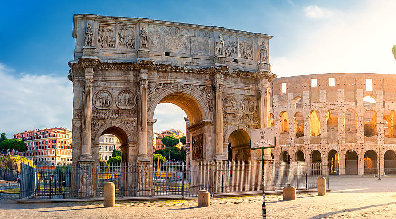 View of the Arc de Triomphe of Constantine and the Colosseum, Rome Discover the famous Colosseum, which takes you back in time to Ancient Rome.
