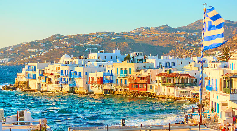 Little Venice, Mykonos, in the rays of the rising sun Little Venice, Mykonos, in the rays of the rising sun