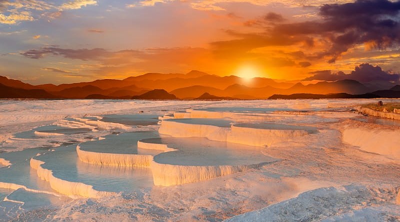 Travertine Pools and Terraces in Pamukkale, Turkey Beautiful sunrise at the Travertine pools and terraces in Turkey