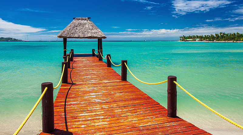 Wooden jetty on tropical beach in Fiji Wooden jetty on tropical beach in Fiji