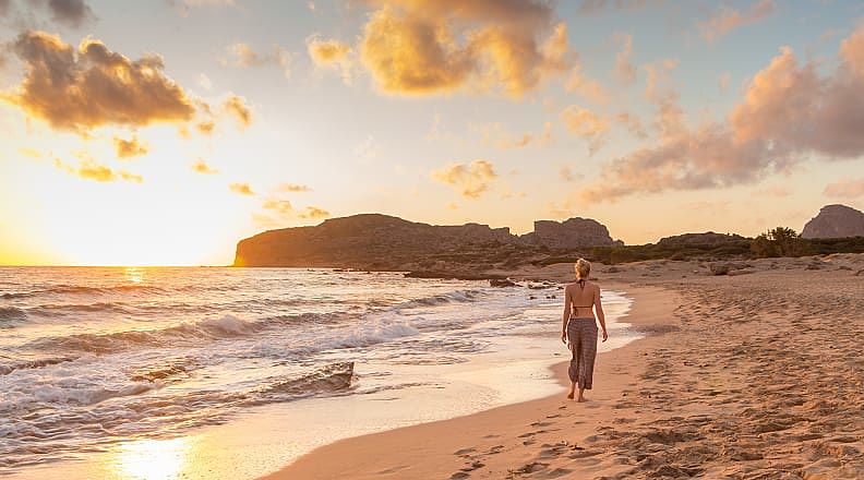 Romantic Greece Getaway: Athens, Santorini & Crete - Walking along Falasnara Beach at sunset in Western Crete