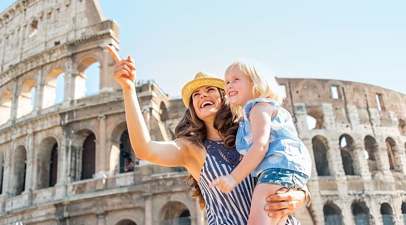 Mother and daughter outside the Roman Colosseum in Italy