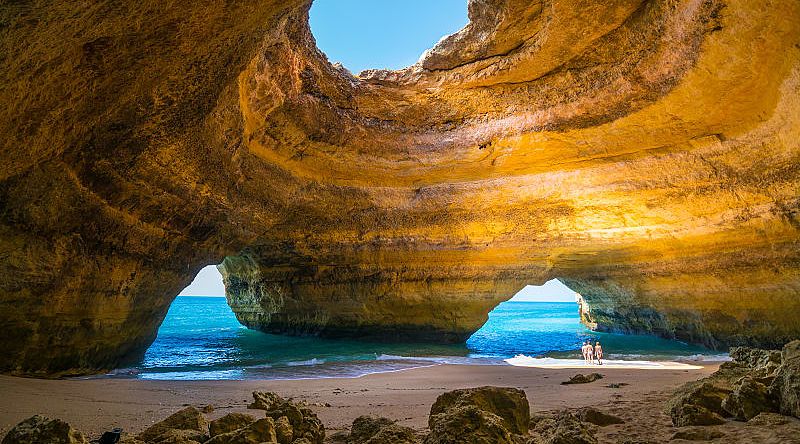 Family exploring the Benagil Caves in Algarve, Portugal