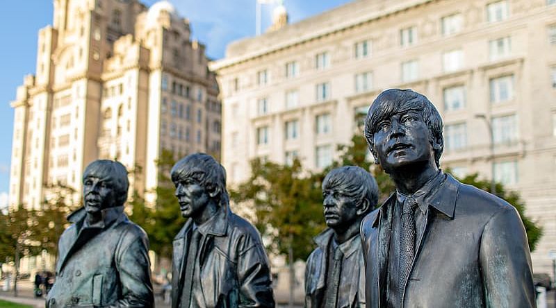 The Beatles Statues in Liverpool, UK. Photo courtesy of: Visit Liverpool Lifelike bronze statues of The Beatles on Liverpool’s waterfront promenade.