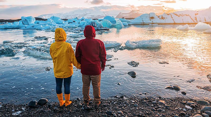 couple at Jokulsarlon Glacier Lagoon in Iceland