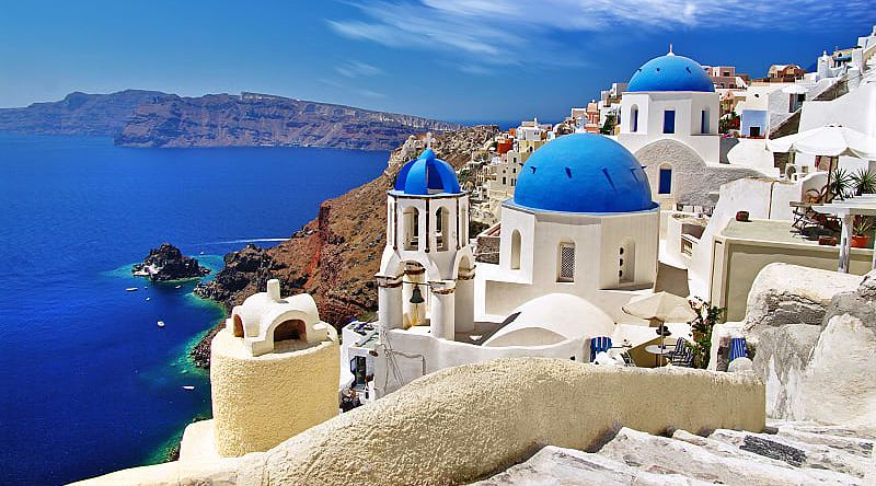 Santorini blue domes with caldera and ocean