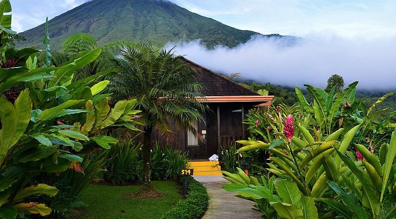 Small cabin with Volcano Arenal in the background in Costa Rica