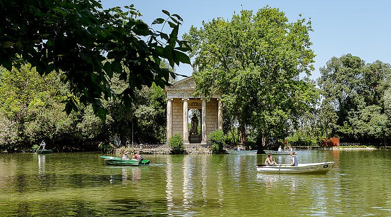 Boats with People Resting on the Pond, Villa Borghese, Rome, Italy Boats with People Resting on the Pond, Villa Borghese, Rome, Italy