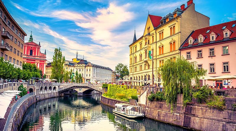 A canal weaving through old town Ljubljana.