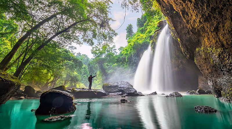 Hiker at Haew Suwat waterfall in Khao Yai National Park, Thailand