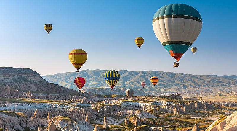 Hot air balloon floating above Cappadocia, Turkey. Hot air balloon floating above Cappadocia, Turkey.