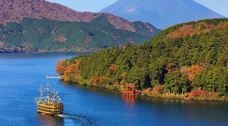 Mt Fuji and Lake Ashi with sightseeing pirate ship in Hakone National Park, Japan.