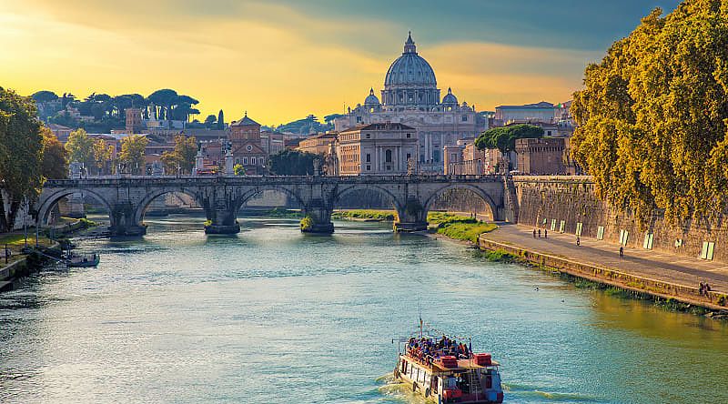 View of the Tiber and St. Peter's Basilica at sunset, Rome, Italy