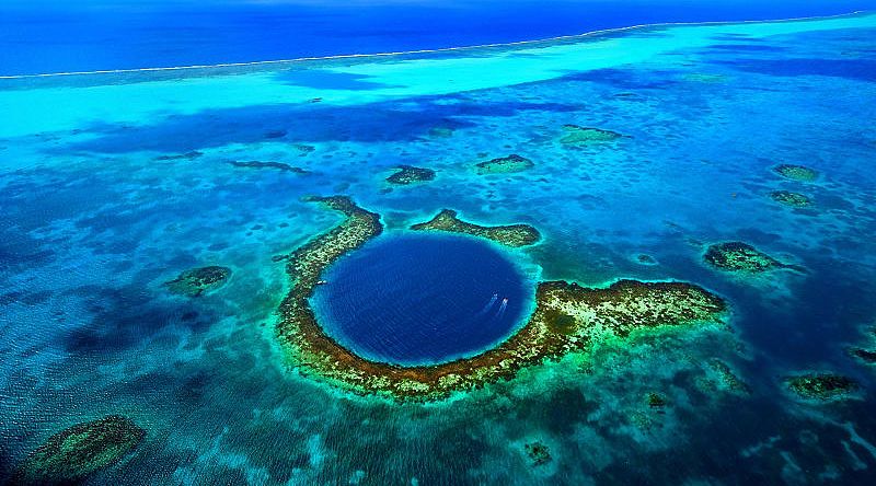 Aerial view of the Great Blue Hole coral reef in Belize Aerial view of the Great Blue Hole coral reef in Belize