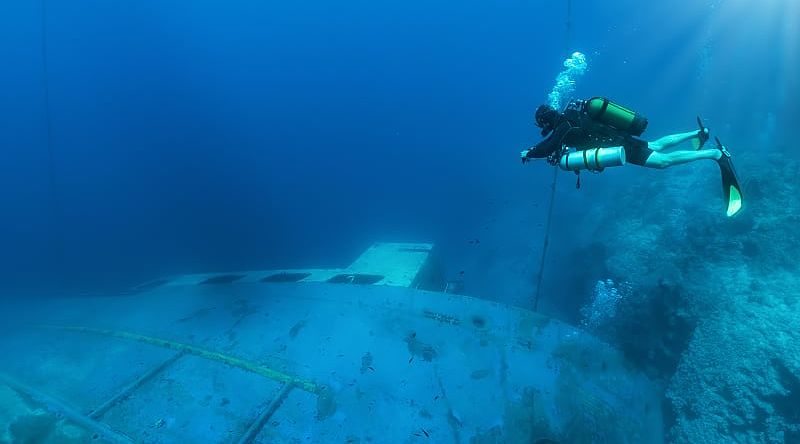 A scuba diver explores a sunken wreck in the Aegean Sea in Greece.