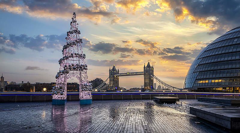 Winter sunrise in London with the Tower Bridge and festive Christmas tree