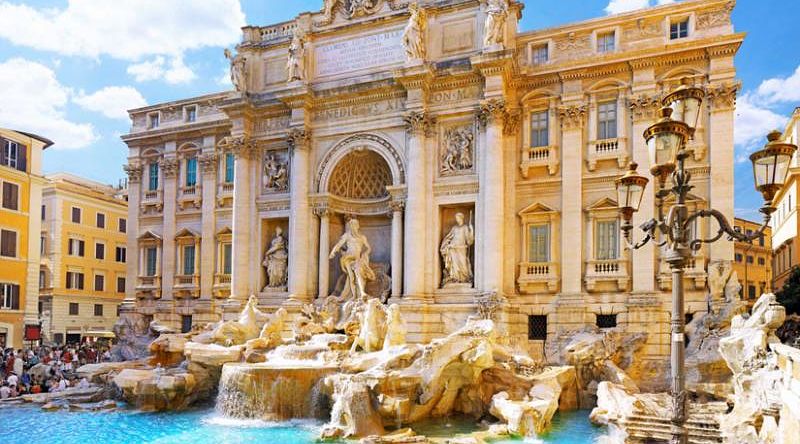 Trevi Fountain in Rome, Italy on a beautiful day with blue skies.