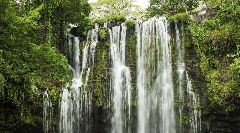 Enjoy the beauty of the waterfalls in the middle of the emerald rainforest, Costa Rica Enjoy the beauty of the waterfalls in the middle of the emerald rainforest, Costa Rica