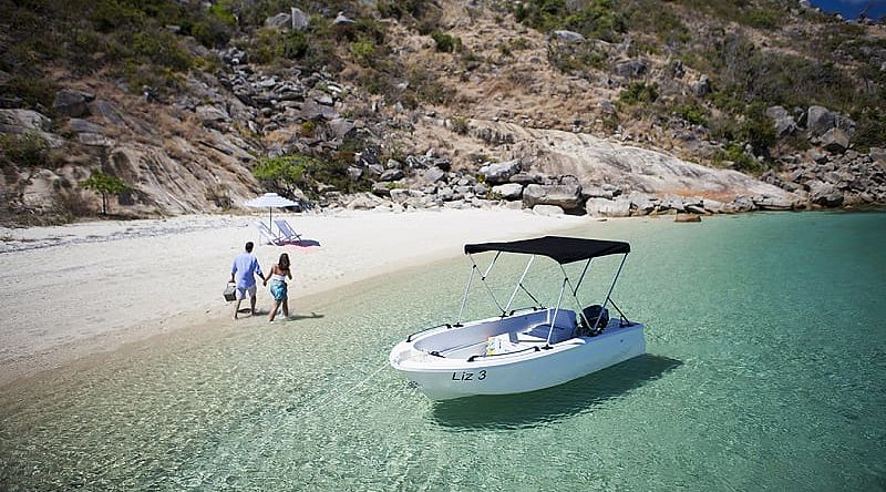 Couple on secluded beach on Lizard Island, Australia