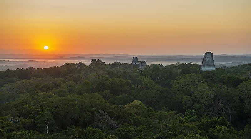 Sunrise landscape of the archaeological site Tikal in Guatemala Sunrise landscape of the archaeological site Tikal in Guatemala