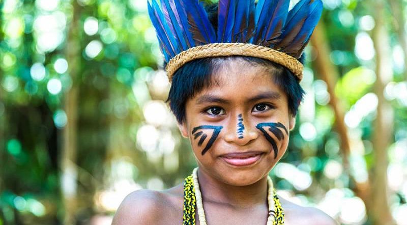 Native brazilian boy from an indigenous tribe in the Amazon