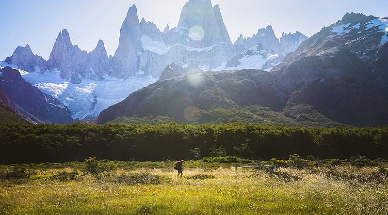 Woman hiking under Fitz Roy in Los Glaciares National Park in Patagonia, Argentina